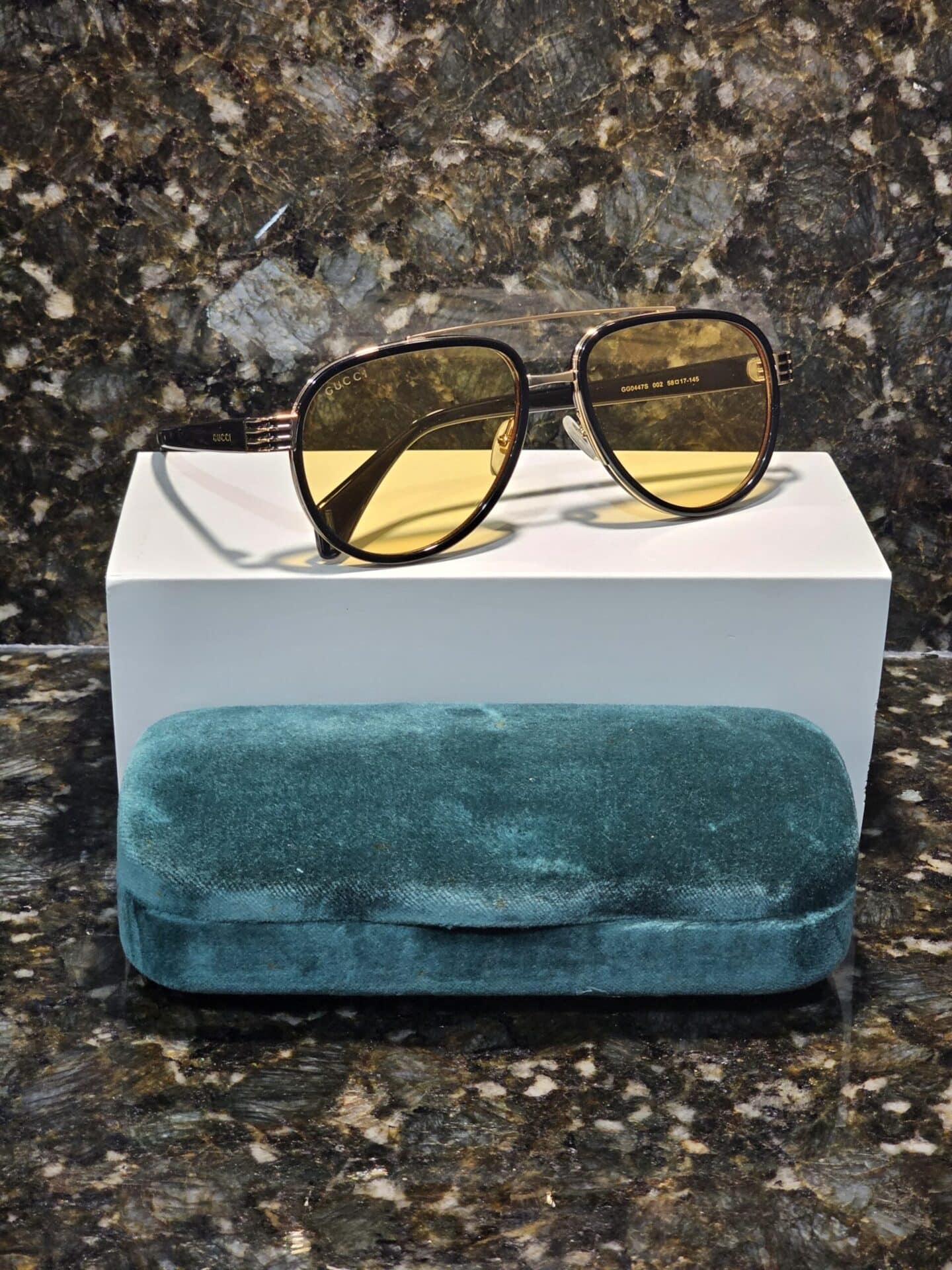 Lentes de sol GG0447S 002 Aviator Negro Ambar Transparente